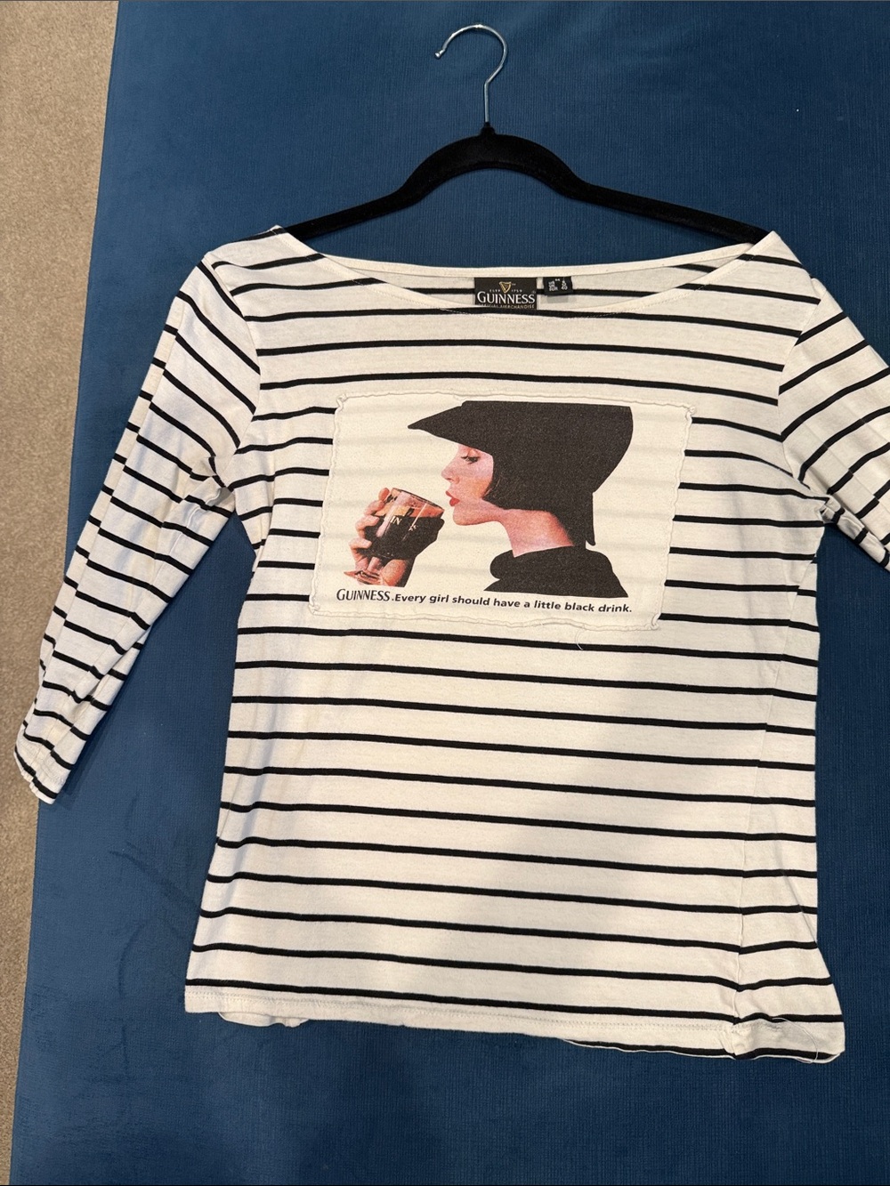 Guinness White and Black Striped Graphic Boatneck Top featuring an elegant lady